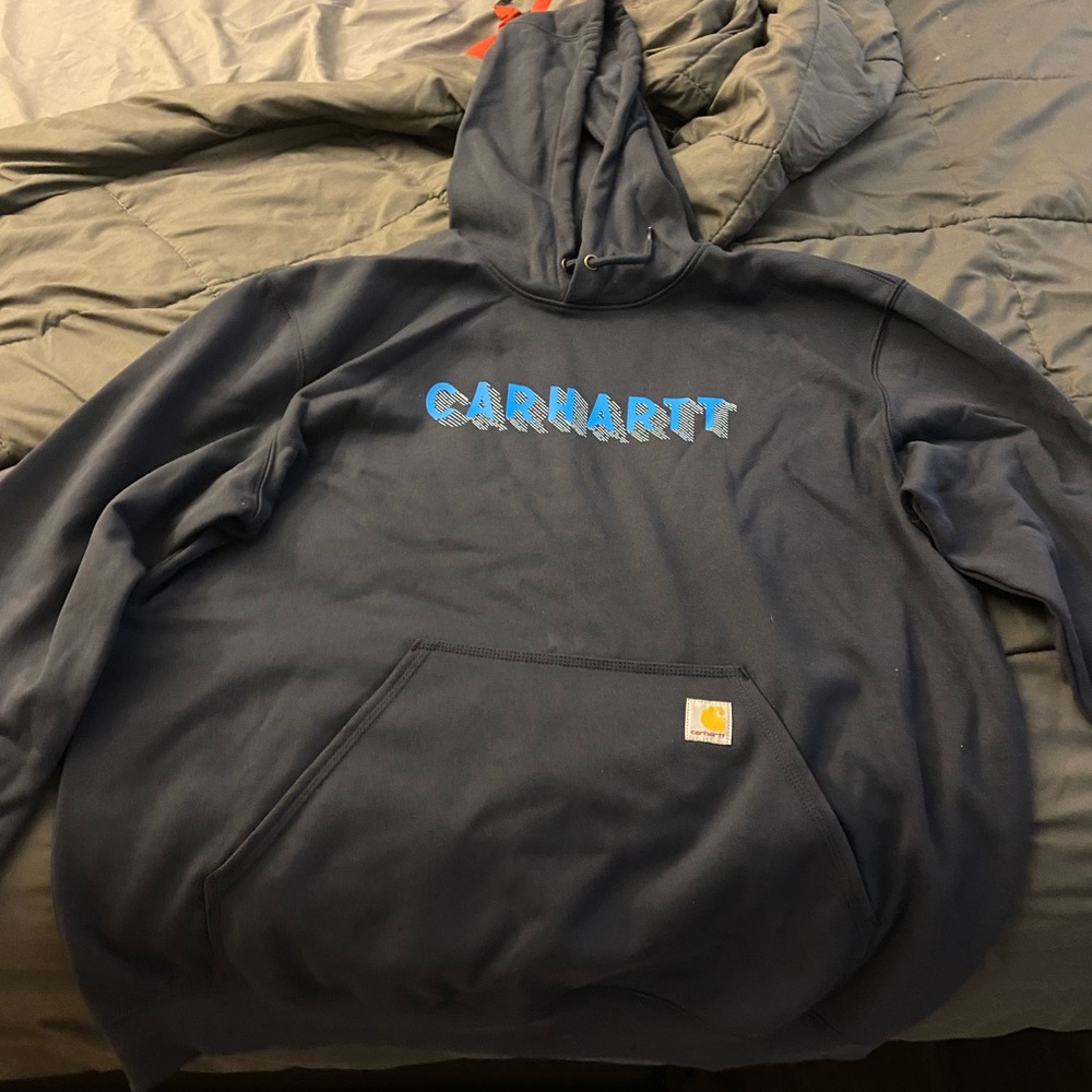 Carhartt navy blue rain, defender jacket never worn/washed tags are off,  xl